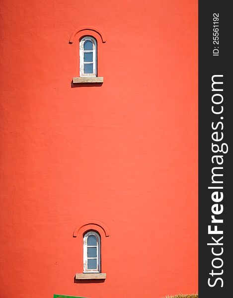 Red building with two small windows