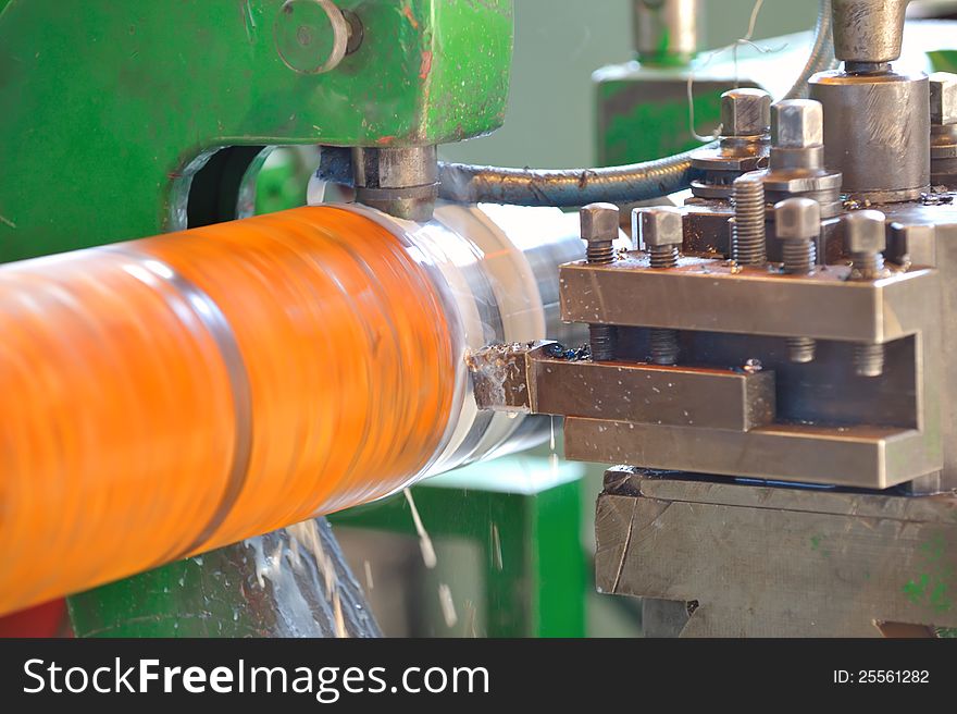 Turning lathe in action inside of factory