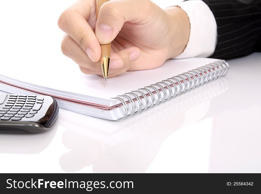 Business woman writing with pen on the notebook. Business woman writing with pen on the notebook