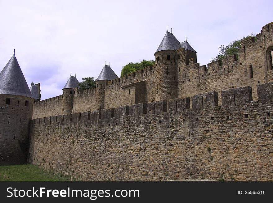 The wall of an ancient fortress of Carcassonne, France. The wall of an ancient fortress of Carcassonne, France