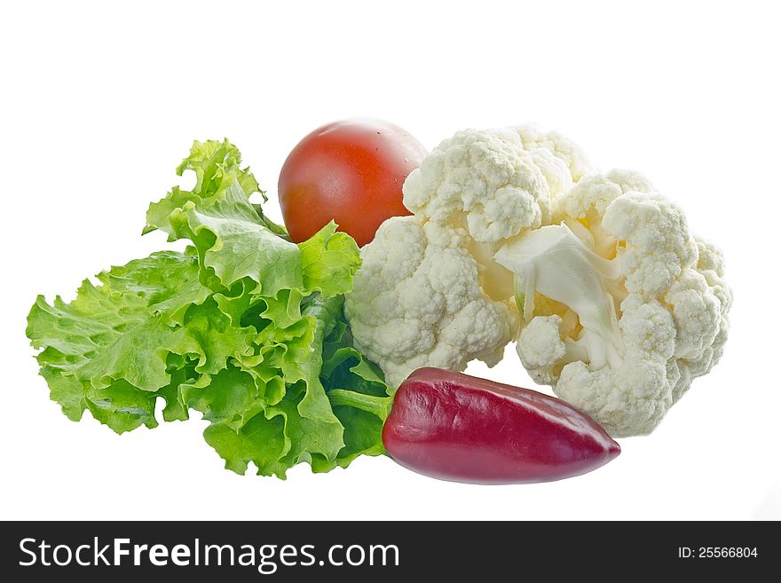 Peppers, lettuce, tomatoes and cauliflower on a white background. Peppers, lettuce, tomatoes and cauliflower on a white background.