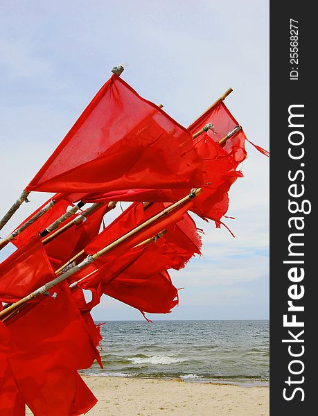 Collected fisherman signal flags flutter in the wind. Collected fisherman signal flags flutter in the wind