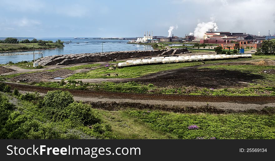 A photo of the local steel plant with the train yard in the foreground. The St. Mary's River runs by the train yard and steel plant and empties into Lake Superior (far upper left). A photo of the local steel plant with the train yard in the foreground. The St. Mary's River runs by the train yard and steel plant and empties into Lake Superior (far upper left).