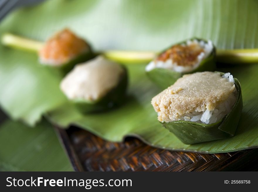 Close up cup of Thai dessert on banana leaf