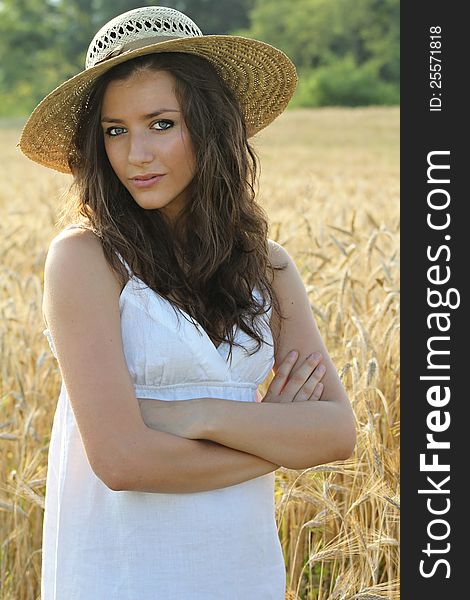 Portrait of pretty girl in wheat field