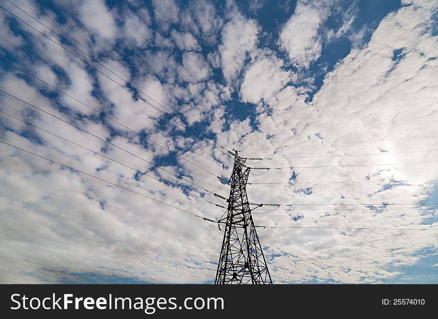 Steel Pylon On Blue Skyvwith Clouds
