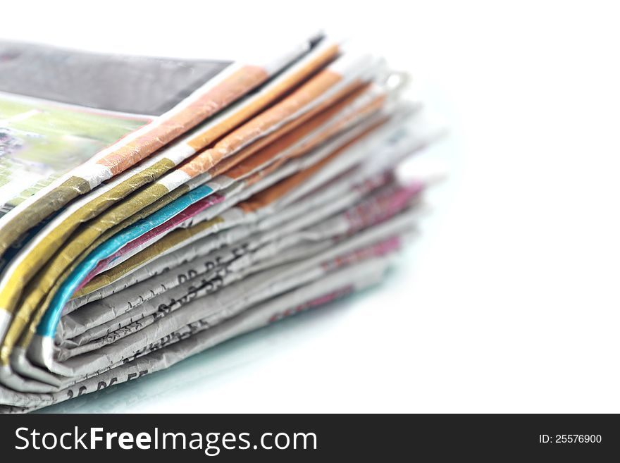 Old newspapers pile up On white background