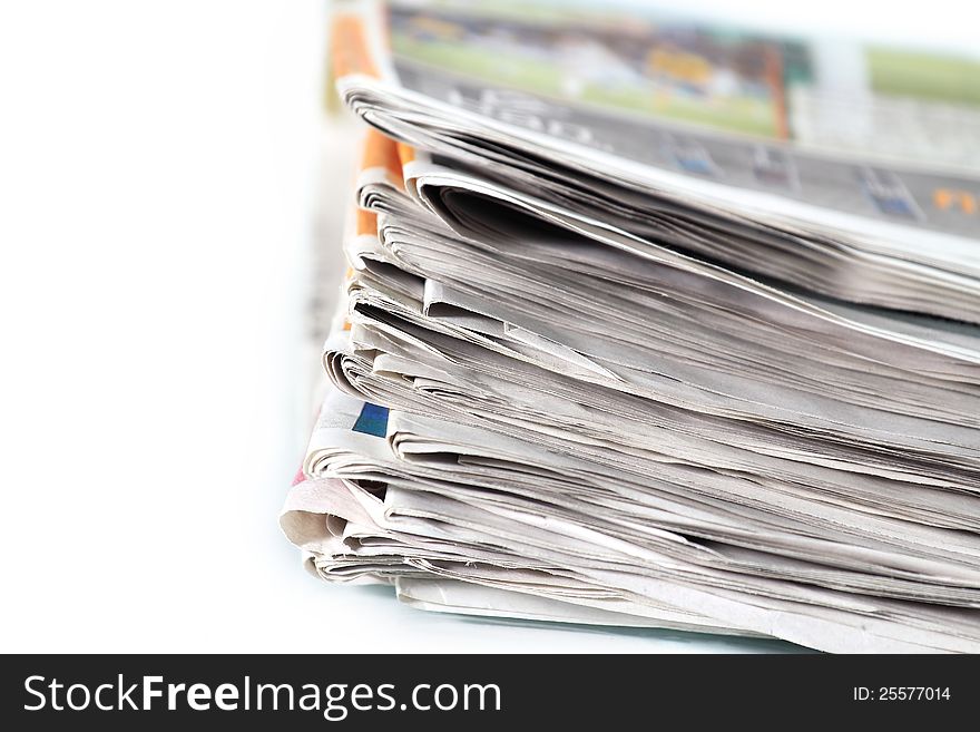 Old newspapers pile up On white background