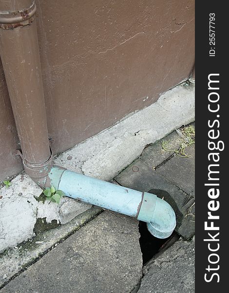 Photo of Sewage pipe for drain water and Garbage into a Concrete drain.