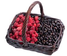 Currants And Raspberries In A Basket Stock Photo