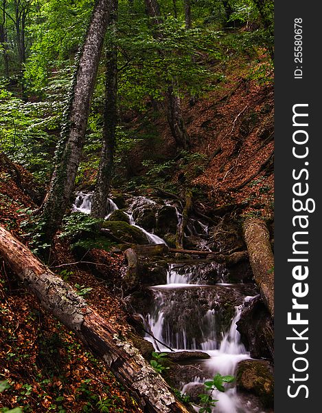 Forest waterfall in motion in Crimea, Ukraine. Forest waterfall in motion in Crimea, Ukraine