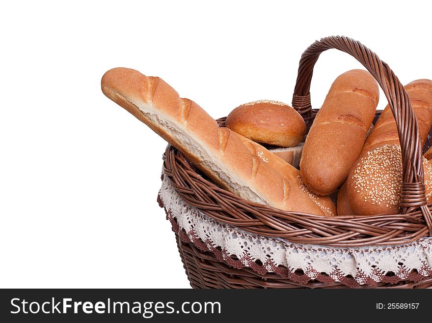 Arrangement of bread in basket isolated on white background