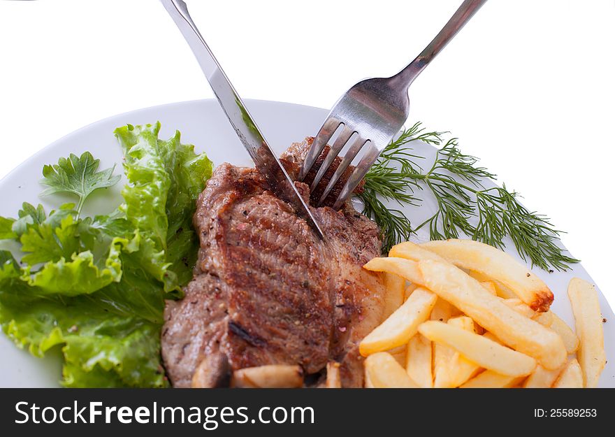 Stake with potato free on the plate  on white