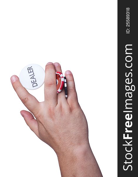 The hand with the dealer button and chips isolated on white