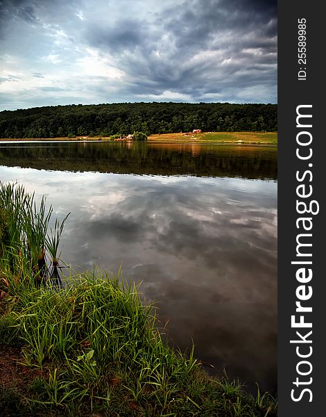 Landscape with lake and forest. Bright colors, beautiful sky. Landscape with lake and forest. Bright colors, beautiful sky.