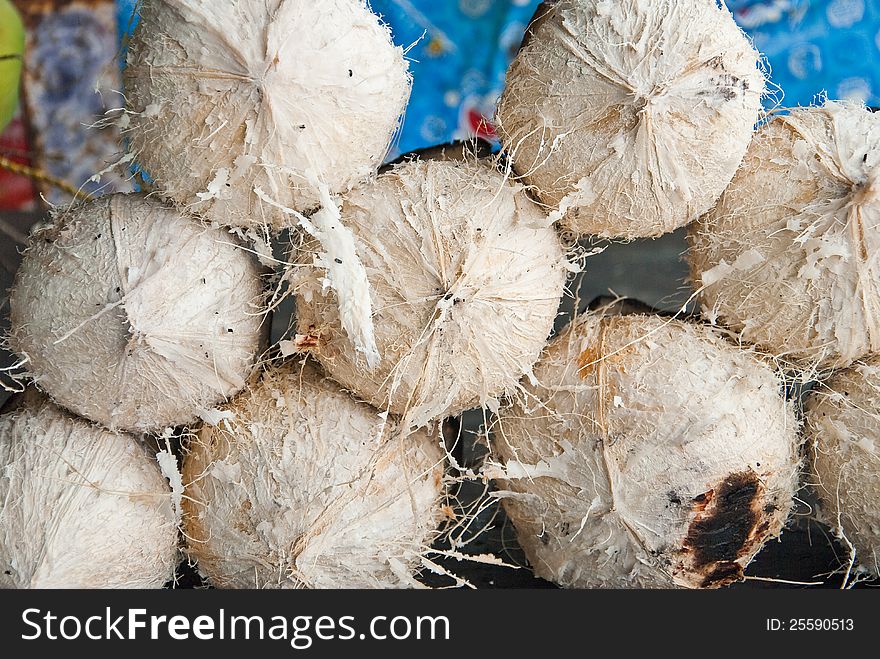 A PILE OF VERY DELICIOUS BURNT COCONUTS