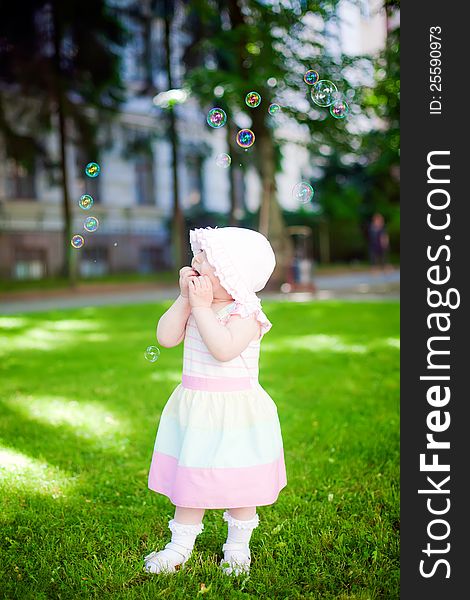 Little girl staring in amazement at soup bubbles. Little girl staring in amazement at soup bubbles