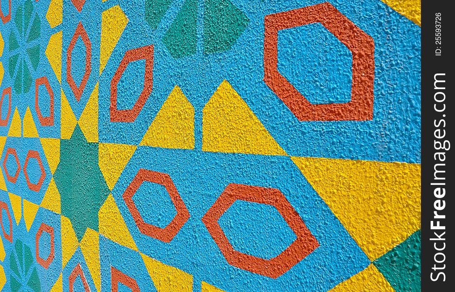 Islamic pattern painted on a textured wall and photographed from the side. Islamic pattern painted on a textured wall and photographed from the side
