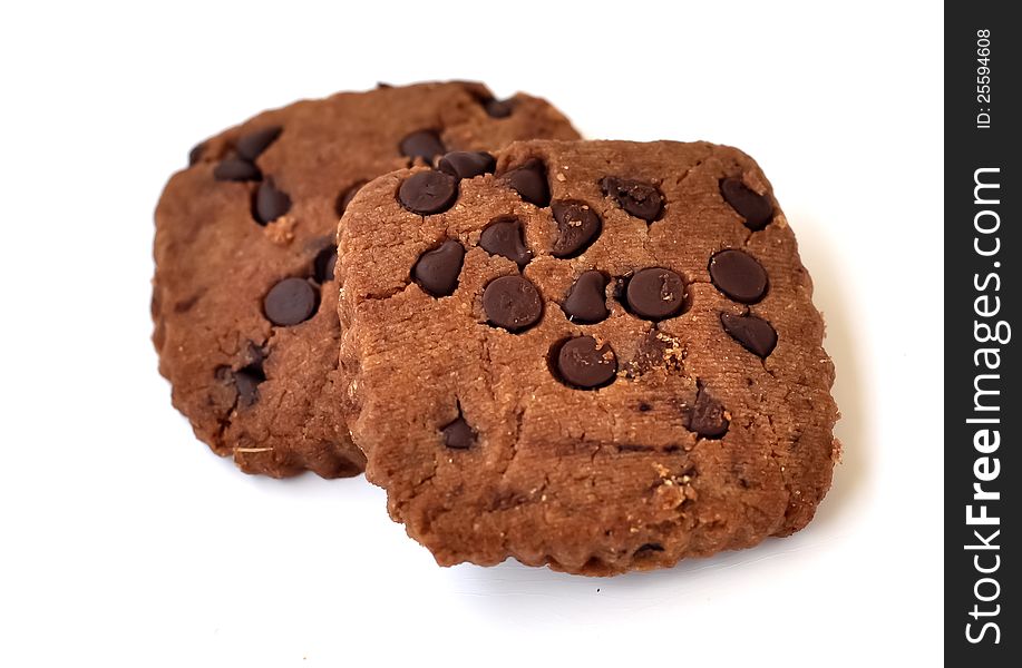 Two rectangular shaped chocolate cookies with chocolate chips. Two rectangular shaped chocolate cookies with chocolate chips