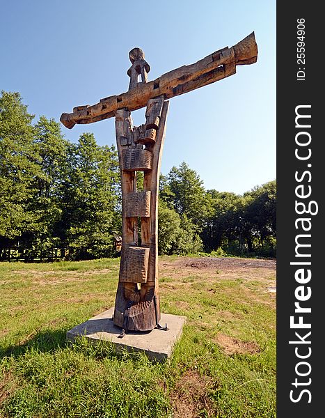 Transylvanian household garden with wooden cross. Transylvanian household garden with wooden cross