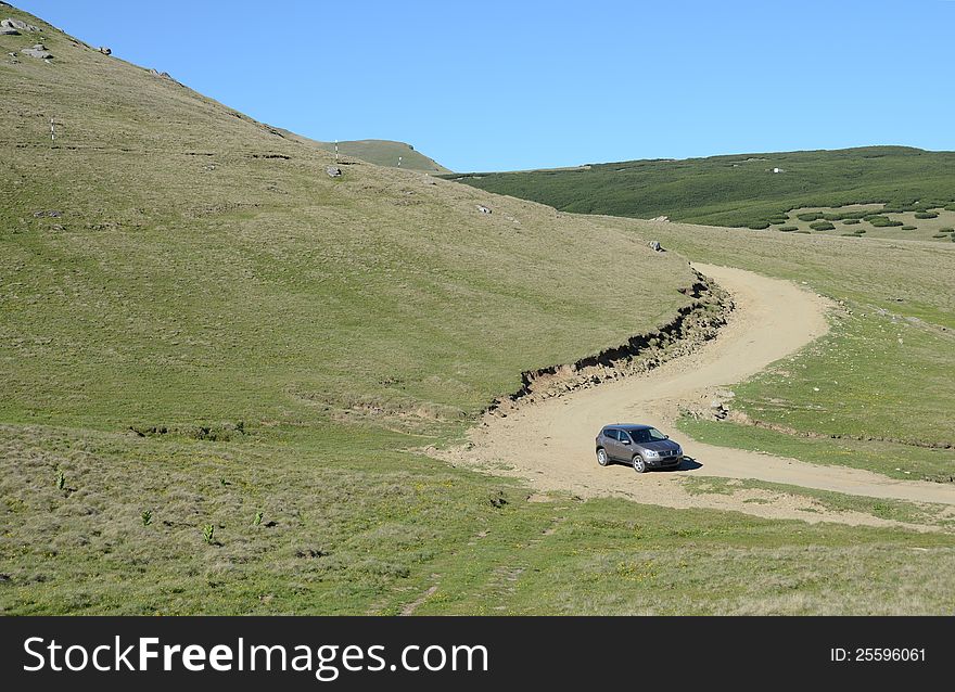 Terrain car on mountain roads. Terrain car on mountain roads