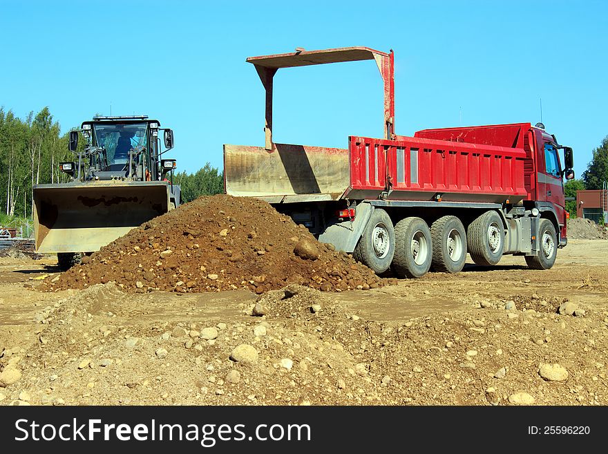 Sand work with truck and excavator. Sand work with truck and excavator