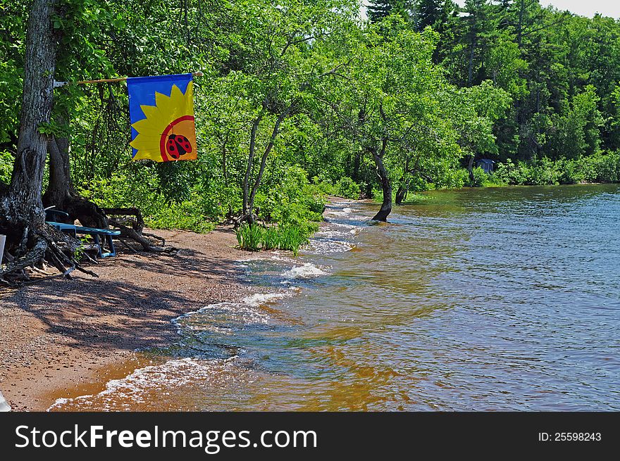 Cottage Beach with Flag to let boaters know that people are at home