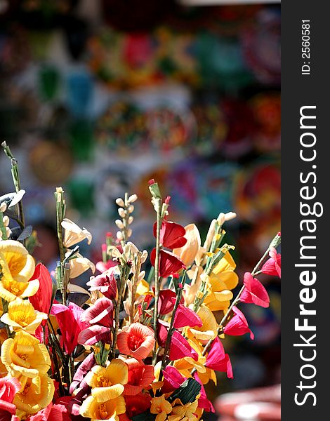 Colorful silk flowers in a market display