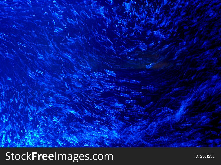 Abstract of air bubbles with blue light taken in slow shutter speed. Abstract of air bubbles with blue light taken in slow shutter speed