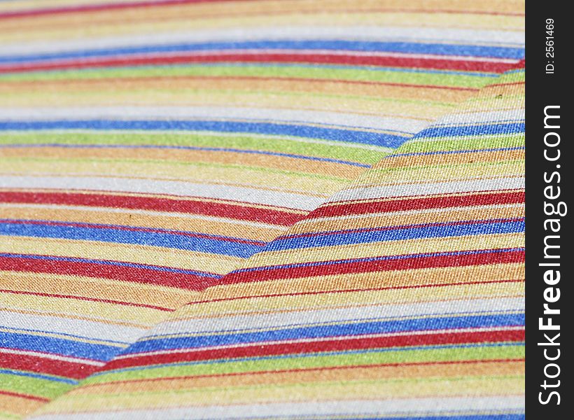 A colorful striped canvas umbrella. A colorful striped canvas umbrella