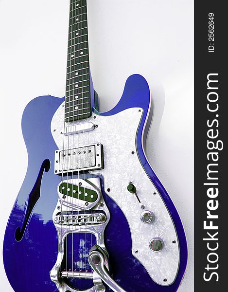 Close-up, detailed electric guitar. Vintage, classic, retro design over a white background. Close-up, detailed electric guitar. Vintage, classic, retro design over a white background.