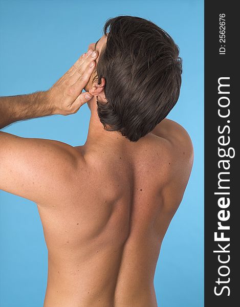 Close up of a young man back over blue background