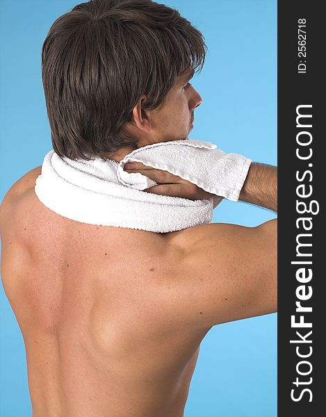 Close up of a young man back over blue background. Close up of a young man back over blue background