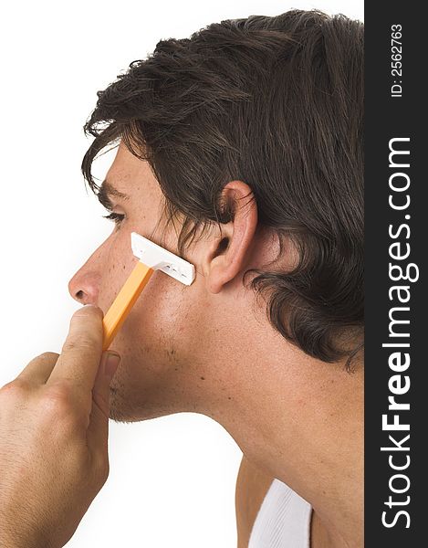 Close up of young man shaving over white background