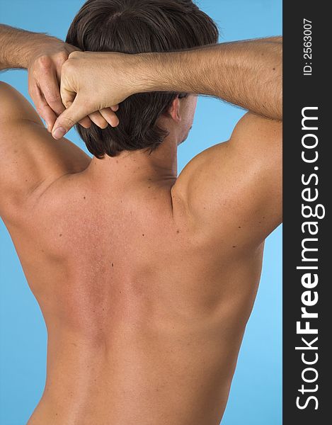 Close up of a young man back over blue background