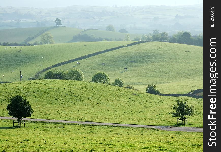 Rolling farmland near Kendal, Cumbria, UK without sky