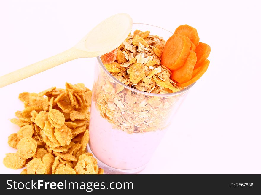 A bowl full of granola isolated on white background. A bowl full of granola isolated on white background