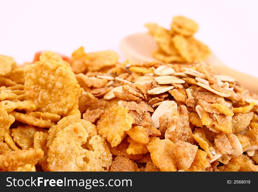 A bowl full of granola isolated on white background. A bowl full of granola isolated on white background