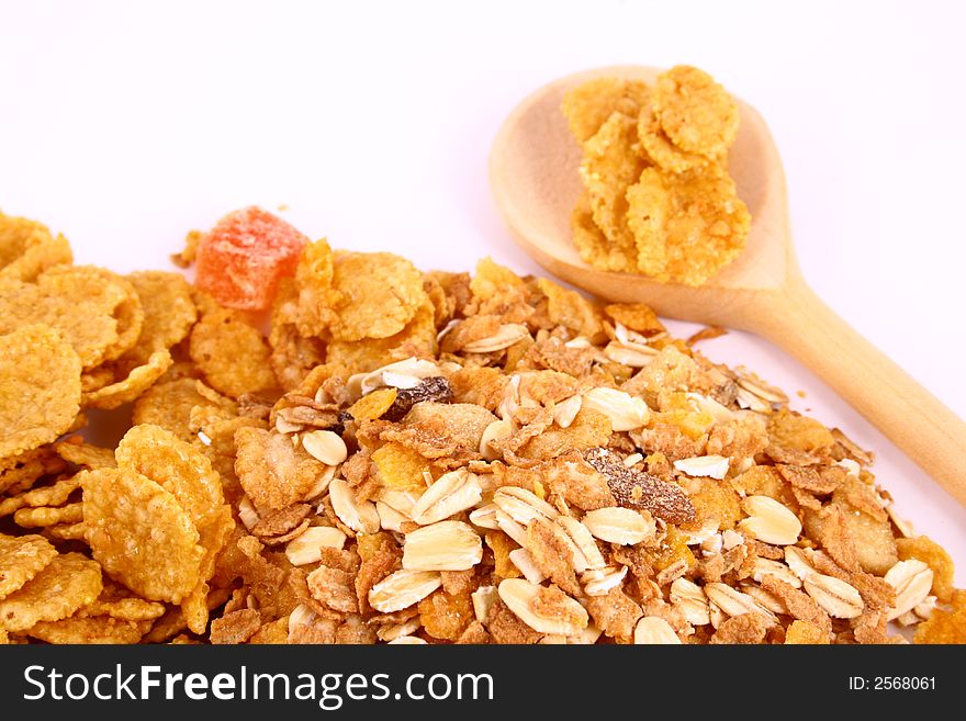 A bowl full of granola isolated on white background. A bowl full of granola isolated on white background