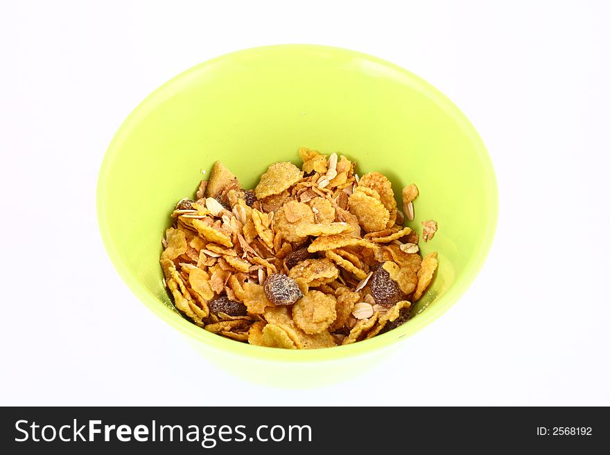 A bowl full of granola isolated on white background. A bowl full of granola isolated on white background