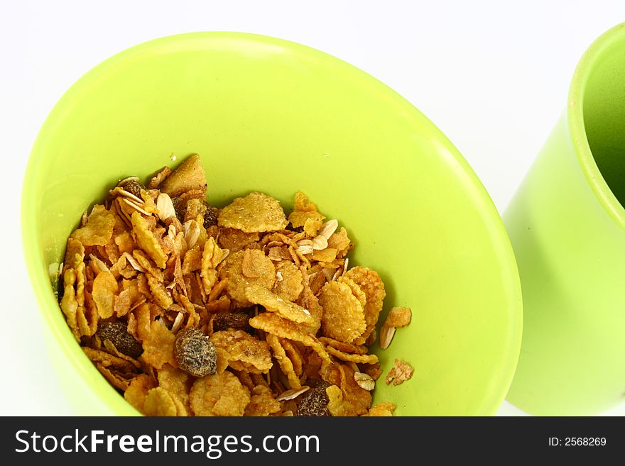 A bowl full of granola isolated on white background. A bowl full of granola isolated on white background