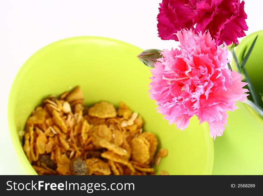 A bowl full of granola isolated on white background. A bowl full of granola isolated on white background