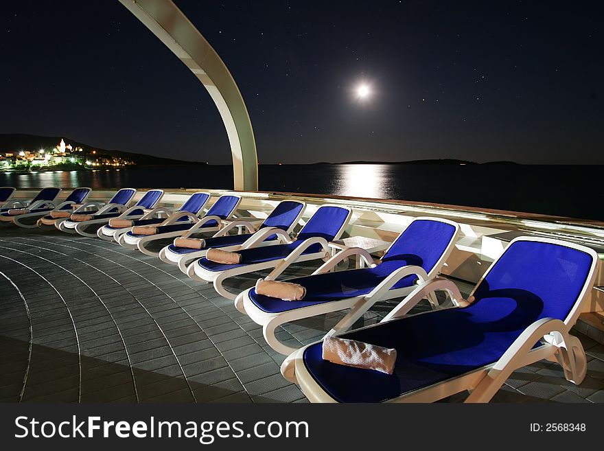 Elegant deck chairs under the stary sky