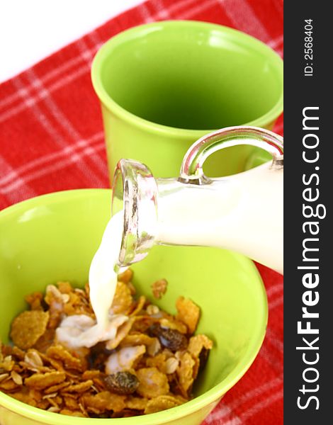 A bowl full of granola isolated on white background. A bowl full of granola isolated on white background