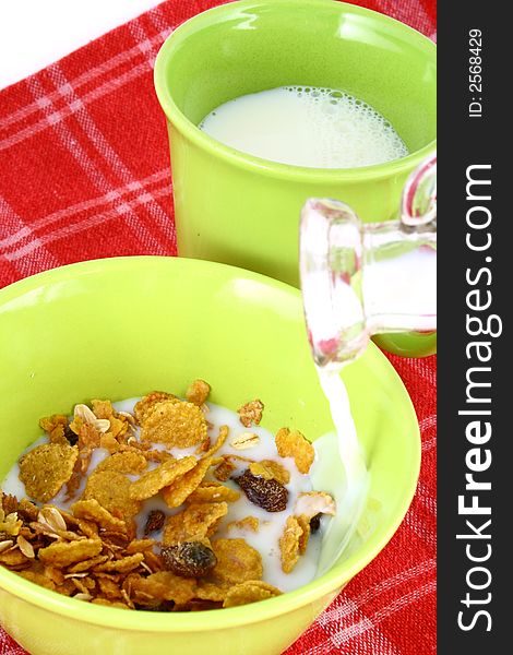 A bowl full of granola isolated on white background. A bowl full of granola isolated on white background