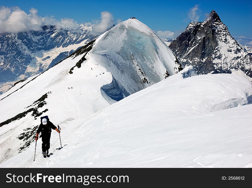 Backcountry skier, at the top of breithhorn, on background the Matterhorn, west Alps, Swiss, Europe.