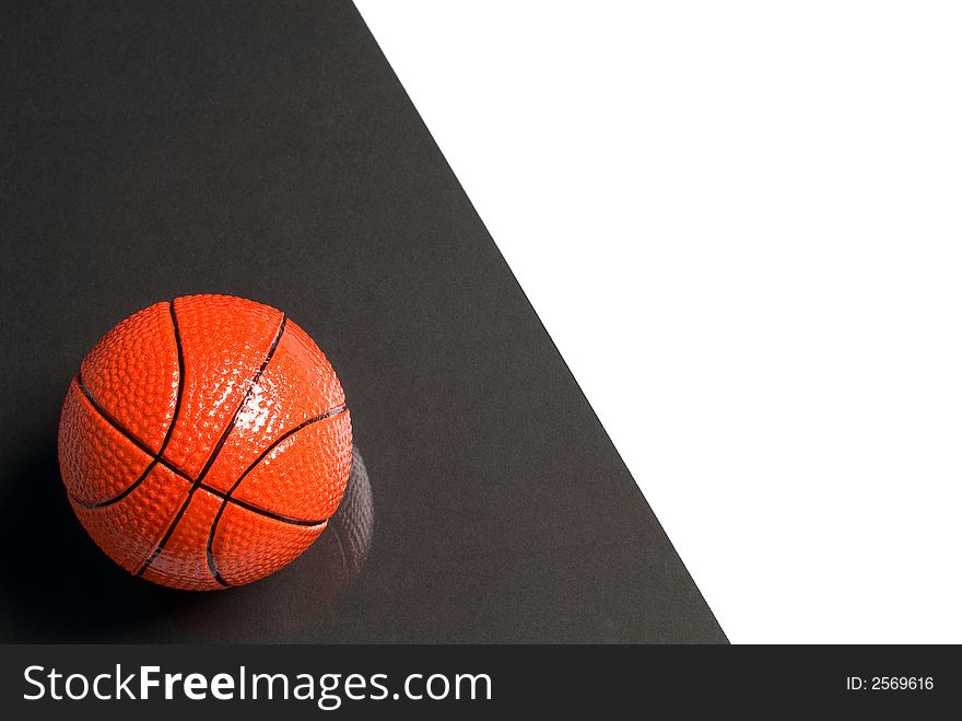 Basketball ball on glass with a black and white background