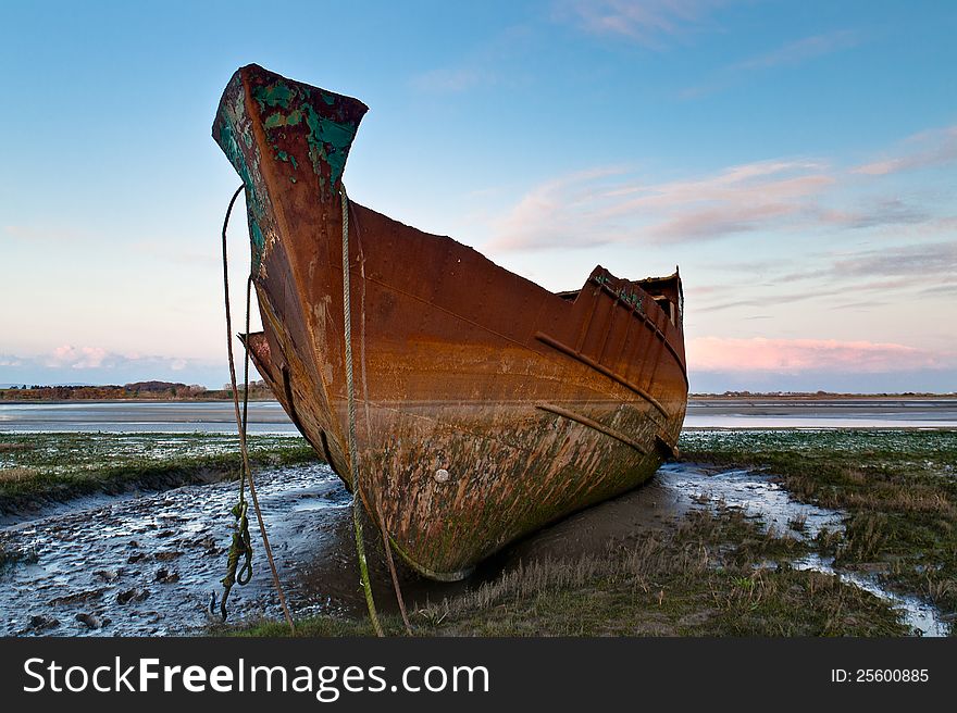 Rusting trawler on Fleetwood Marsh in the UK - indicative of the decline of the fishing industry in the area