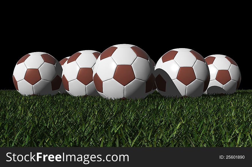 Brown soccer balls on a green grass - black background