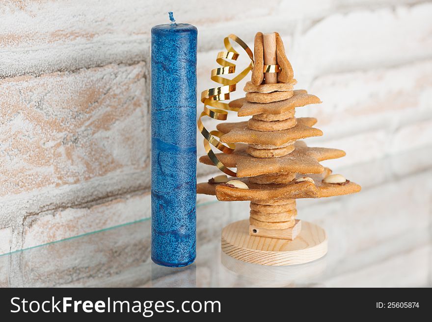 Blue candle with Christmas decorations.